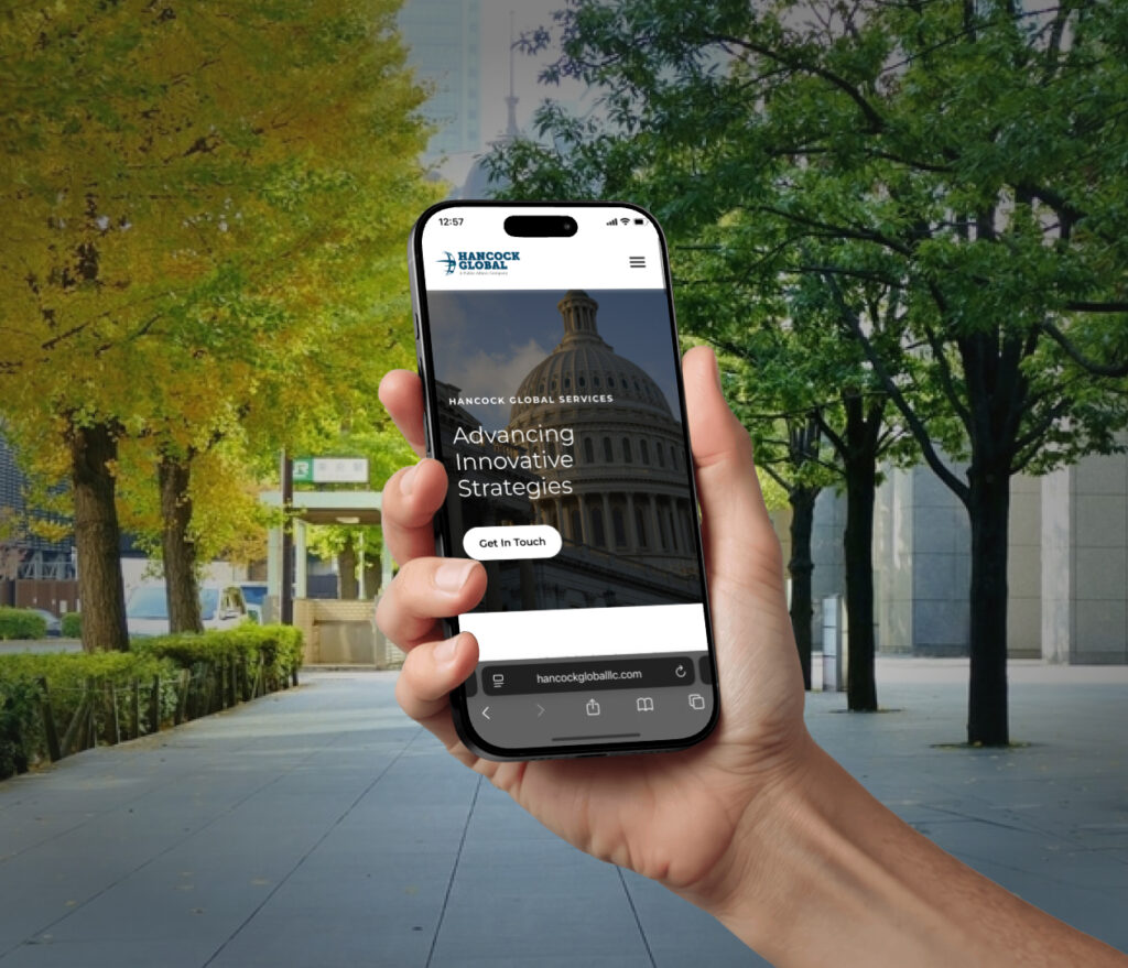 hand holding hancock website phone