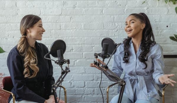 two women at a podcast